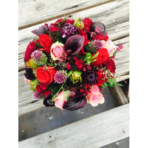 Chic Winder wedding flowers in dark reds and Burgundy